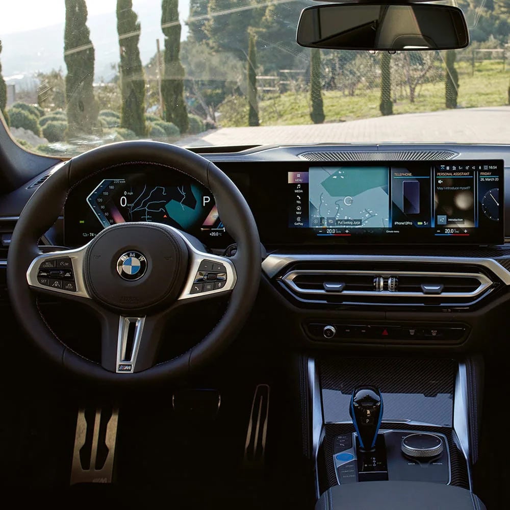 A driver's eye view of steering wheel and controls of the BMW i4 | Ferman BMW in Palm Harbor FL
