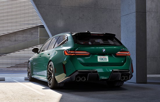 Green BMW M5 Touring parked in garage. | Ferman BMW in Palm Harbor FL