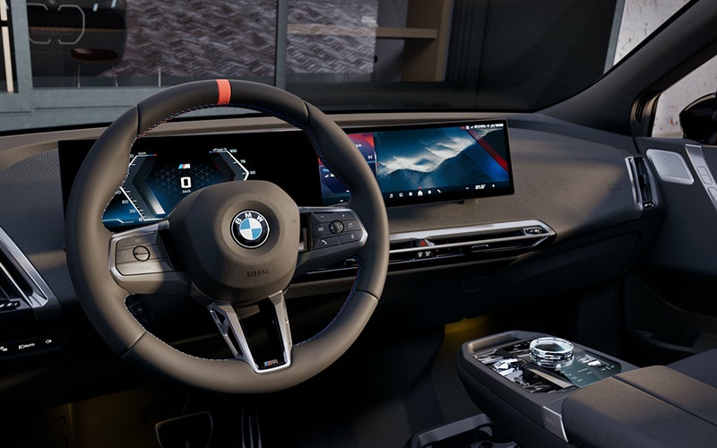 Interior steering wheel and dashboard of the BMW iX M70. | Ferman BMW in Palm Harbor FL